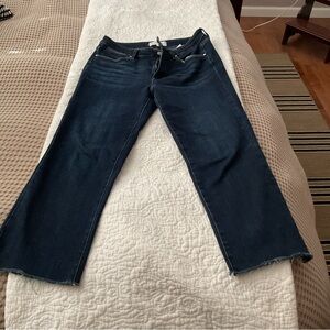 RISEN cropped straight leg raw edge jeans.